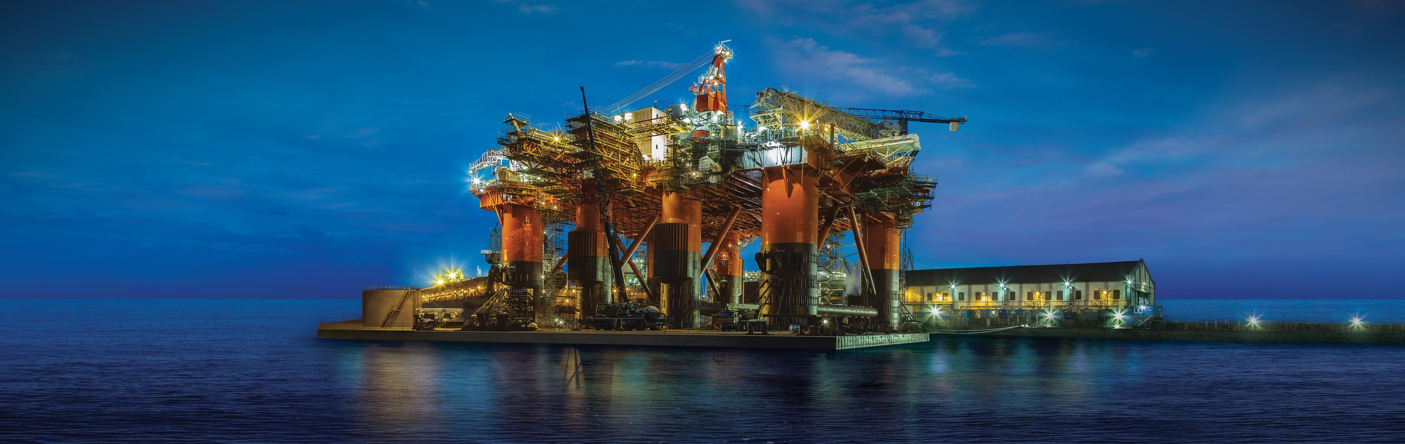 Offshore platform lit at twilight